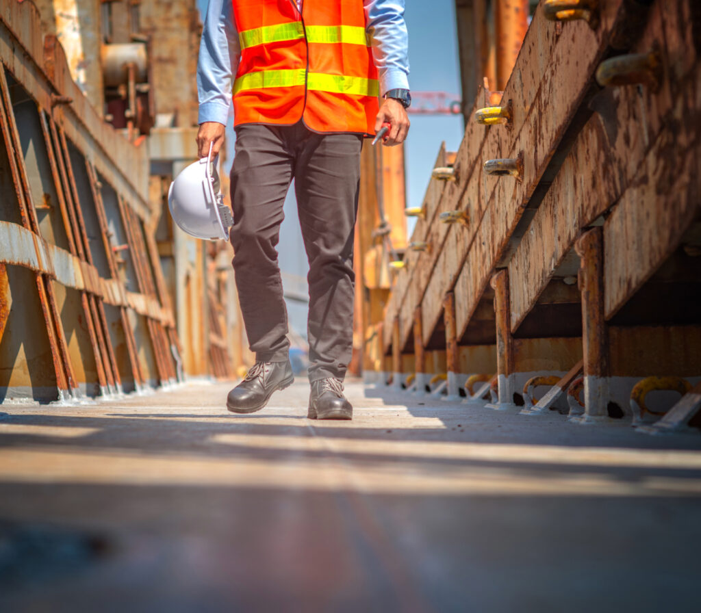 Occupational health professional conducting a fitness for duty assessment with a worker in a workplace setting