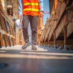 Occupational health professional conducting a fitness for duty assessment with a worker in a workplace setting